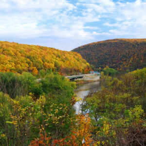 Delaware Water Gap panorama in Autumn with colorful foliage with forest and mountain over river.